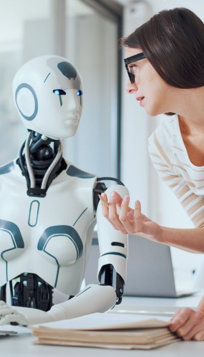 Woman and AI robot working together